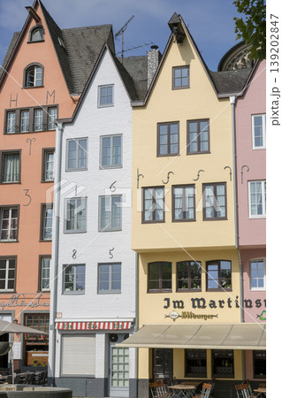Cologne, Germany - July 07, 2018: Fountain "Fish shops" against a backdrop of beautiful houses in the center of Cologne 139202847