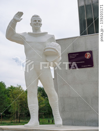 Cosmonaut Yuri Gagarin statue honoring space exploration with a sleek monument under a cloudy sky Cosmonaut Yuri Gagarin statue honoring space exploration with a sleek monument under a cloudy sky 139203171