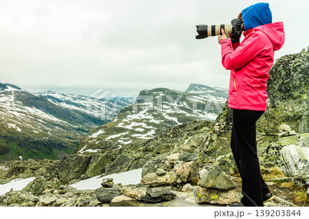 Tourist taking photo from Dalsnibba viewpoint Norway Tourist taking photo from Dalsnibba viewpoint Norway 139203844