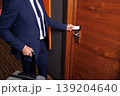 Close Up Of Business Traveler Opening Hotel Room Door With Electronic Key Card 139204640