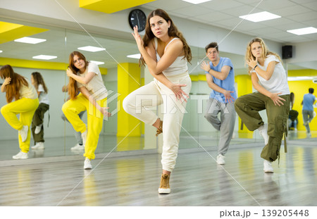 Young girl dancing modern dance in studio 139205448