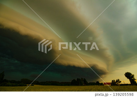 Storm clouds of thunderstorm over a field in Lithuania Storm clouds of thunderstorm over a field in Lithuania 139205598