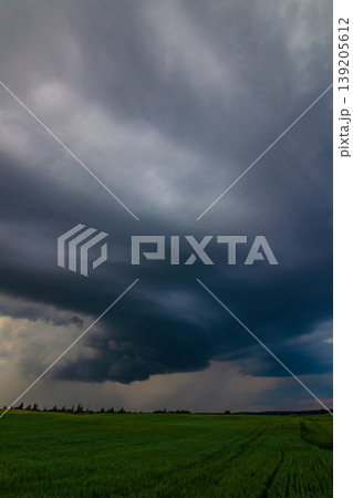 Storm clouds of thunderstorm over a field in Lithuania Storm clouds of thunderstorm over a field in Lithuania 139205612