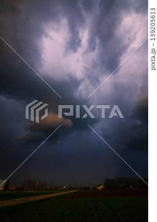 Storm clouds of thunderstorm over a field in Lithuania Storm clouds of thunderstorm over a field in Lithuania 139205613
