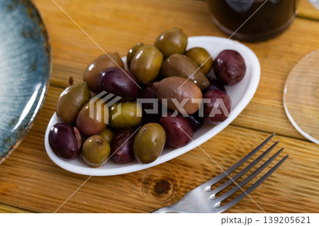 Black olives and green olives in bowl Black olives and green olives in bowl 139205621