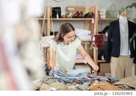 Teen chooses jeans 139205963