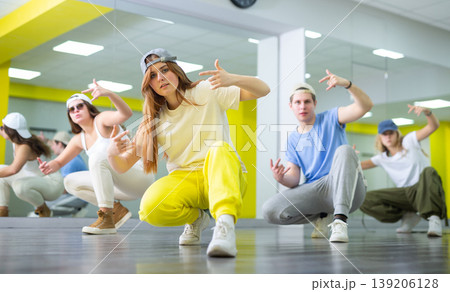 Teen girl in cap dances hip hop dances Teen girl in cap dances hip hop dances 139206128