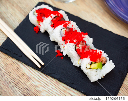 Urumaki roll with salmon avocado pepino and tobiko Urumaki roll with salmon avocado pepino and tobiko 139206136