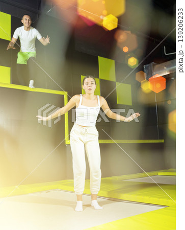 Woman sportswoman fitness jumping on club trampoline 139206233