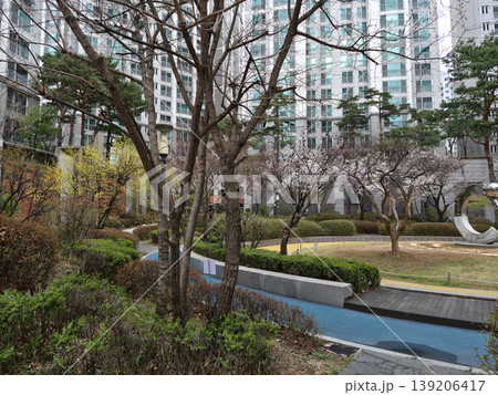 It is a walking path in the apartment garden. It is a walking path in the apartment garden. 139206417