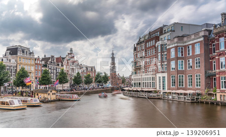 Panoramic timelapse hyperlapse of Amsterdam city center featuring Amstel River, waterfront and Munttoren tower. Netherlands 139206951