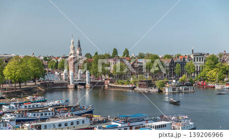 City panorama of Amsterdam aerial timelapse featuring the Montelbaanstoren tower. Netherlands City panorama of Amsterdam aerial timelapse featuring the Montelbaanstoren tower. Netherlands 139206966