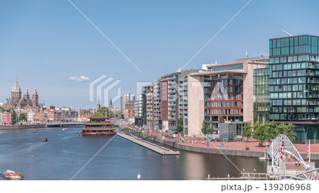 Aerial panorama of pagoda on the water, set against the backdrop of historical city center architecture timelapse. Amsterdam, Netherlands Aerial panorama of pagoda on the water, set against the backdrop of historical city center architecture timelapse. Amsterdam, Netherlands 139206968