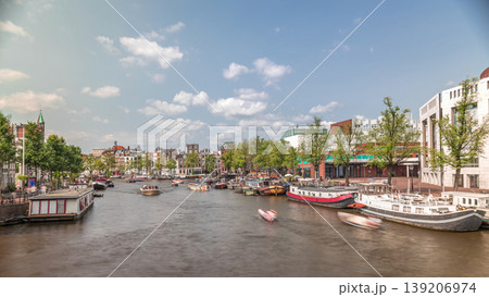 Boats floating near the National Opera music and theatre venue timelapse. Amsterdam, The Netherlands Boats floating near the National Opera music and theatre venue timelapse. Amsterdam, The Netherlands 139206974