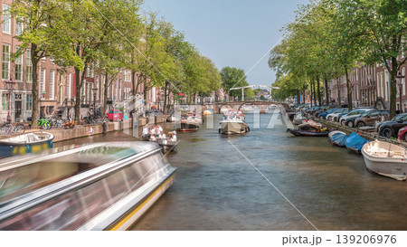 Timelapse of a busy canal boat trip in Amsterdam's city center on a sunny day. Amsterdam, Netherlands 139206976