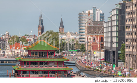 Aerial view of pagoda on the water, set against the backdrop of historical city center architecture timelapse. Amsterdam, Netherlands Aerial view of pagoda on the water, set against the backdrop of historical city center architecture timelapse. Amsterdam, Netherlands 139206980