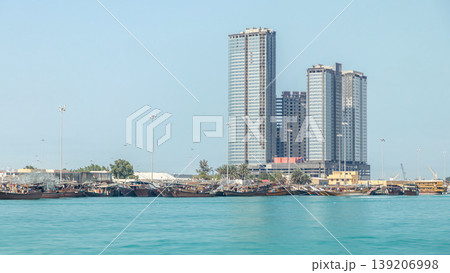 Traditional wooden fishing dhows berthed in the Dhow Harbour in Abu Dhabi timelapse Traditional wooden fishing dhows berthed in the Dhow Harbour in Abu Dhabi timelapse 139206998