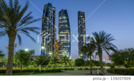 Skyscrapers of Abu Dhabi with Etihad Towers buildings day to night timelapse. Skyscrapers of Abu Dhabi with Etihad Towers buildings day to night timelapse. 139207009