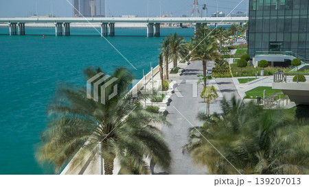 Walkway in Abu Dhabi timelapse with palms Walkway in Abu Dhabi timelapse with palms 139207013