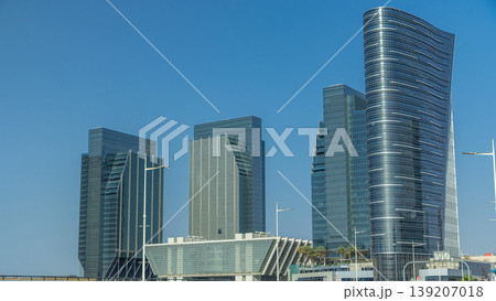 Modern buildings in Abu Dhabi skyline timelapse with waterfront. Modern buildings in Abu Dhabi skyline timelapse with waterfront. 139207018