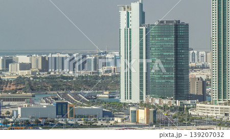Buildings on Al Reem island in Abu Dhabi timelapse from above. Buildings on Al Reem island in Abu Dhabi timelapse from above. 139207032