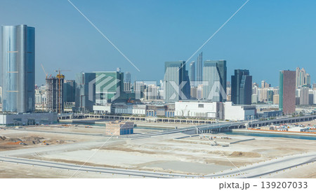 Buildings on Al Reem island in Abu Dhabi timelapse from above. Buildings on Al Reem island in Abu Dhabi timelapse from above. 139207033
