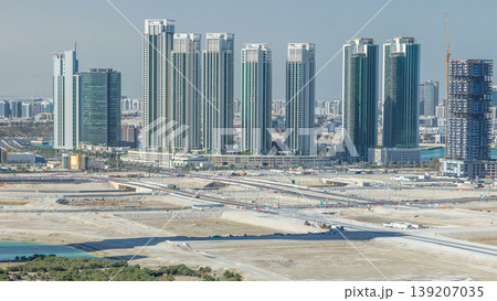 Buildings on Al Reem island in Abu Dhabi timelapse from above. 139207035