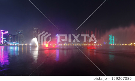 Evening Musical fountain show. Singing fountains in Sharjah timelapse, UAE 139207089