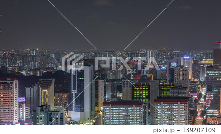 Aerial cityscape of Singapore downtown of modern architecture with skyscrapers night timelapse Aerial cityscape of Singapore downtown of modern architecture with skyscrapers night timelapse 139207109