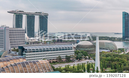 Evening panorama with Marina Bay area and skyscrapers city skyline aerial timelapse. 139207128