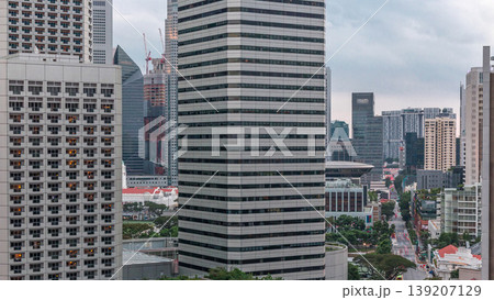 Evening panorama with Marina Bay area and skyscrapers city skyline aerial timelapse. 139207129