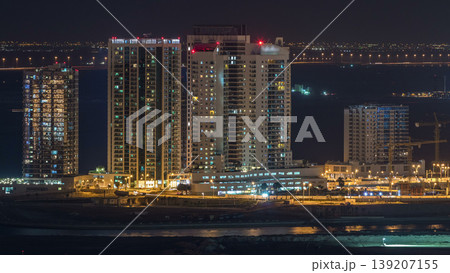 Aerial skyline of Abu Dhabi city centre from above night timelapse Aerial skyline of Abu Dhabi city centre from above night timelapse 139207155