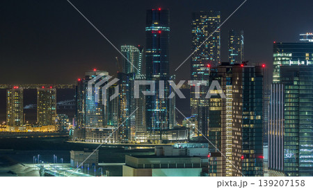 Aerial skyline of Abu Dhabi city centre from above night timelapse Aerial skyline of Abu Dhabi city centre from above night timelapse 139207158
