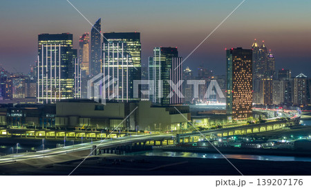 Buildings on Al Reem island in Abu Dhabi day to night timelapse from above. 139207176