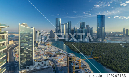 Buildings on Al Reem island in Abu Dhabi timelapse from above. 139207188