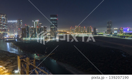 Buildings on Al Reem island in Abu Dhabi night timelapse from above. Buildings on Al Reem island in Abu Dhabi night timelapse from above. 139207190