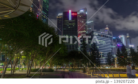 Business Financial Downtown City and Skyscrapers Tower Building at Marina Bay night timelapse hyperlapse, Singapore 139207220