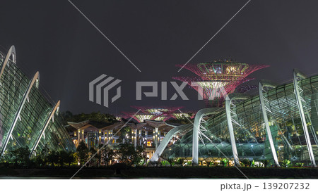 A night view of The Supertree Grove, Cloud Forest and Flower Dome at Gardens by the Bay in Singapore timelapse. A night view of The Supertree Grove, Cloud Forest and Flower Dome at Gardens by the Bay in Singapore timelapse. 139207232