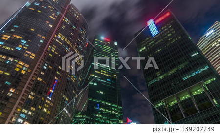 Looking up perspective of modern business skyscrapers glass and sky view landscape of commercial building in central city timelapse hyperlapse Looking up perspective of modern business skyscrapers glass and sky view landscape of commercial building in central city timelapse hyperlapse 139207239