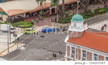 Aerial view of intersection and art deco shophouses along Neil road in Chinatown area timelapse Aerial view of intersection and art deco shophouses along Neil road in Chinatown area timelapse 139207263