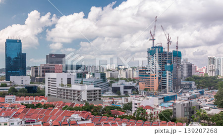 Aerial view of Chinatown with red roofs and Central Business District skyscrapers timelapse, Singapore Aerial view of Chinatown with red roofs and Central Business District skyscrapers timelapse, Singapore 139207268
