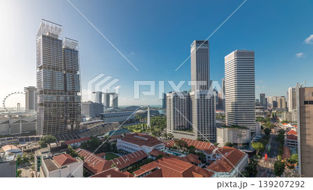 A beautiful morning panorama with Marina Bay area and skyscrapers city skyline aerial timelapse. A beautiful morning panorama with Marina Bay area and skyscrapers city skyline aerial timelapse. 139207292