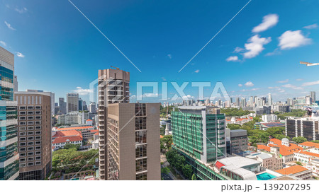 Beautiful green Victoria street with city buildings skyline aerial timelapse in Singapore Beautiful green Victoria street with city buildings skyline aerial timelapse in Singapore 139207295