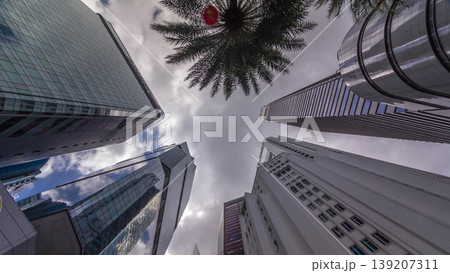Looking up perspective of modern business skyscrapers glass and sky view landscape of commercial building in central city timelapse Looking up perspective of modern business skyscrapers glass and sky view landscape of commercial building in central city timelapse 139207311