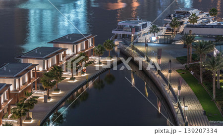 Small houses near canal in Dubai at night, UAE aerial timelapse 139207334