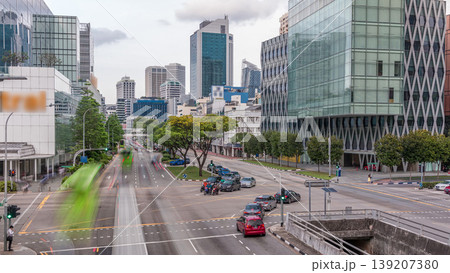 Traffic with cars on a street and urban scene in the central district of Singapore timelapse Traffic with cars on a street and urban scene in the central district of Singapore timelapse 139207380