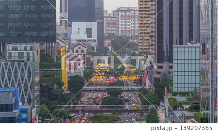 Traffic with cars on a street and urban scene in the central district of Singapore timelapse Traffic with cars on a street and urban scene in the central district of Singapore timelapse 139207385