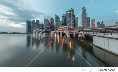 Esplanade bridge and downtown core skyscrapers in the background Singapore night to day timelapse Esplanade bridge and downtown core skyscrapers in the background Singapore night to day timelapse 139207392