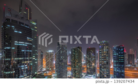 Residential and office buildings in Jumeirah lake towers district night timelapse in Dubai Residential and office buildings in Jumeirah lake towers district night timelapse in Dubai 139207434