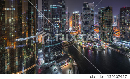 Residential and office buildings in Jumeirah lake towers district night timelapse in Dubai 139207437